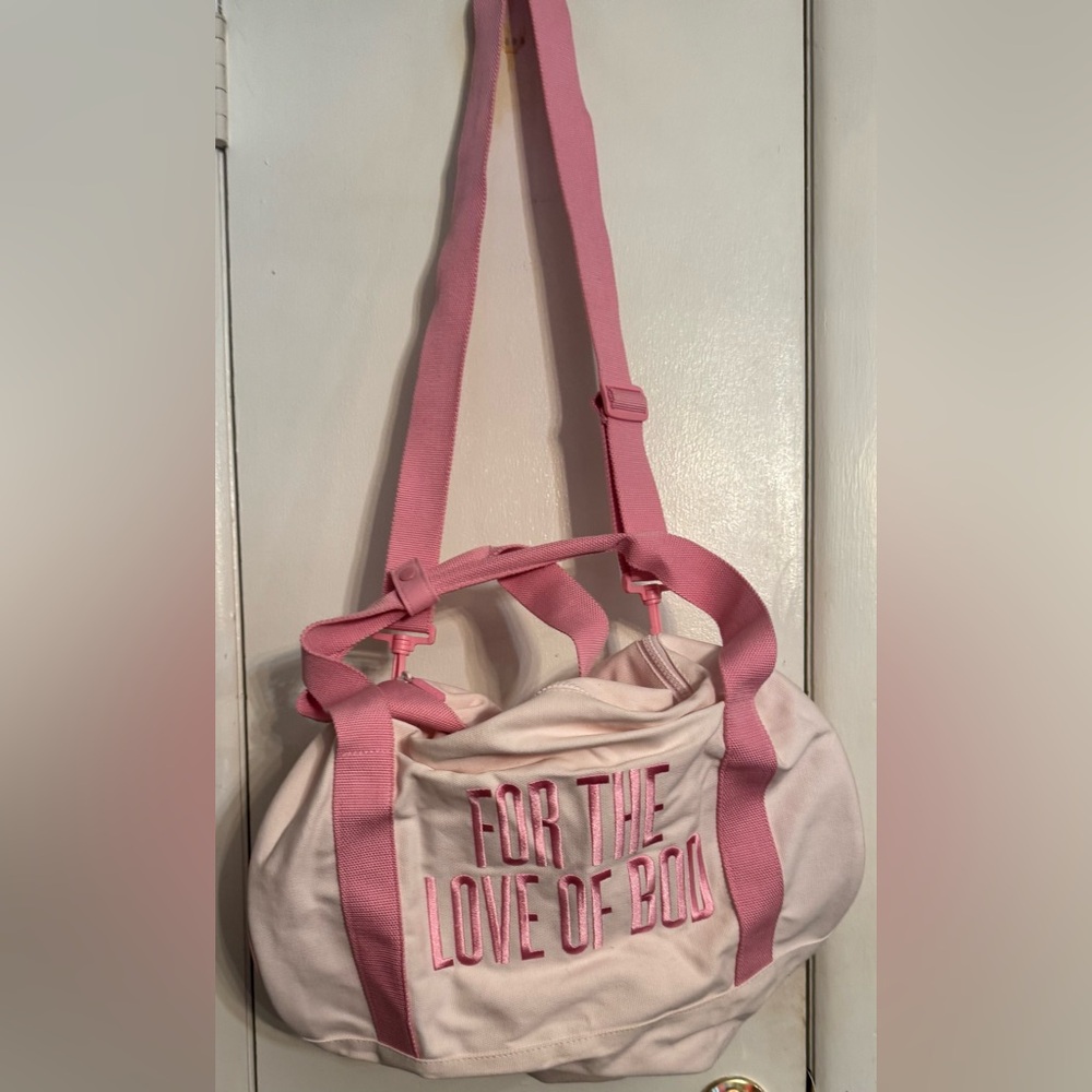 Pink Travel Bag with Adjustable Straps and Canvas Fabric